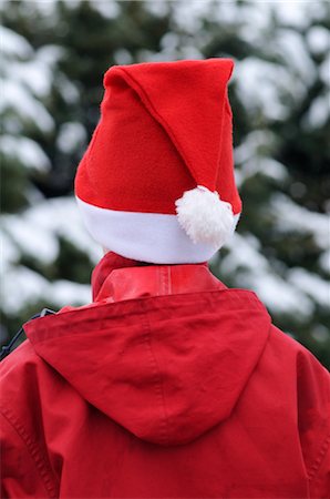 Rear-View of Person Wearing Santa Hat Stock Photo - Premium Royalty-Free, Code: 600-02645985