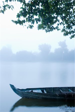 Canoe in Morning Mist at Sras Srang, Angkor, Cambodia Stock Photo - Premium Royalty-Free, Code: 600-02669496