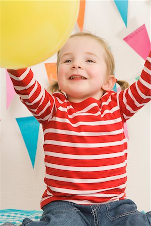 simsearch:600-02660154,k - Little Girl Playing With a Balloon at a Birthday Party Stock Photo - Premium Royalty-Free, Code: 600-02660153