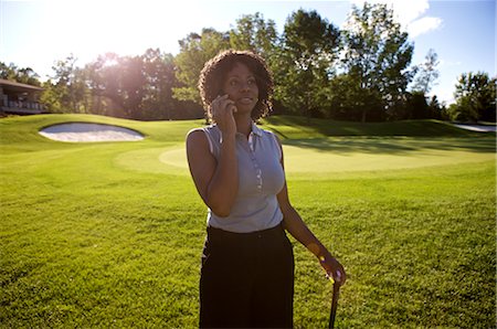 Golfer with Cellular Phone, Burlington, Ontario, Canada Stock Photo - Premium Royalty-Free, Code: 600-02670435