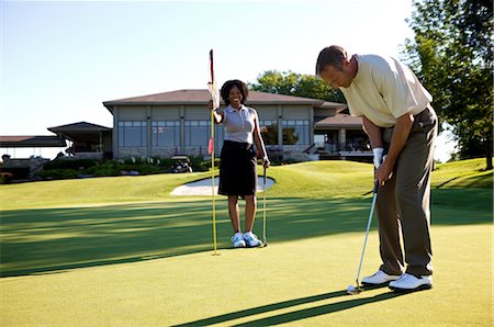 Couple Golfing, Burlington, Ontario, Canada Stock Photo - Premium Royalty-Free, Code: 600-02670440