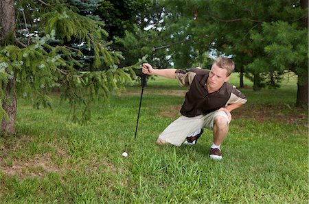 difficult golf shot - Man with Golf Ball in Rough, Burlington, Ontario, Canada Stock Photo - Premium Royalty-Free, Code: 600-02670472