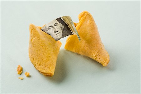 Fortune Cookie with Dollar Bill Inside Stock Photo - Premium Royalty-Free, Code: 600-02670806