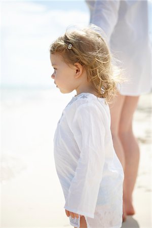 Little Girl Holding Mother's Hand and Walking on Beach Stock Photo - Premium Royalty-Free, Code: 600-02686147
