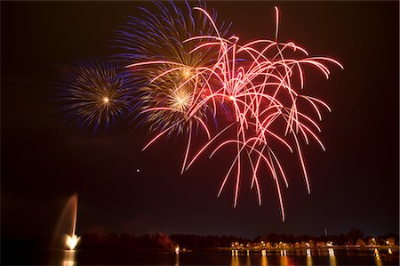 sky and city and night - Fireworks over Little Lake, Peterborough, Ontario, Canada Stock Photo - Premium Royalty-Free, Code: 600-02694361