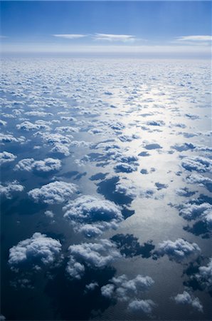 Aerial View of Clouds and Blue Sky Over Pacific Ocean Stock Photo - Premium Royalty-Free, Code: 600-02694416