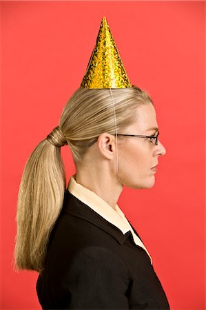 profile 40s woman head and shoulders one person studio shot side view - Businesswoman Wearing Party Hat Stock Photo - Premium Royalty-Free, Code: 600-02694647