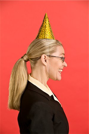 Businesswoman Wearing Party Hat Foto de stock - Sin royalties Premium, Código: 600-02694679