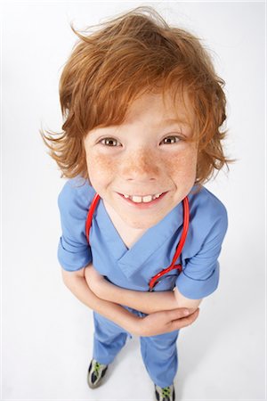 eye contact red hair freckles - Boy Dressed as Doctor Stock Photo - Premium Royalty-Free, Code: 600-02693650