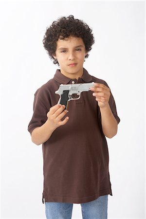 pistola - Boy with Gun Fotografie stock - Premium Royalty-Free, Codice: 600-02693707