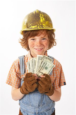 simsearch:600-02738040,k - Little Boy Dressed Up as Construction Worker Holding Cash Stock Photo - Premium Royalty-Free, Code: 600-02693756