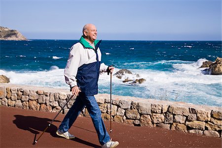 simsearch:600-02290085,k - Man Nordic Walking by the Sea Photographie de stock - Premium Libres de Droits, Code: 600-02693876