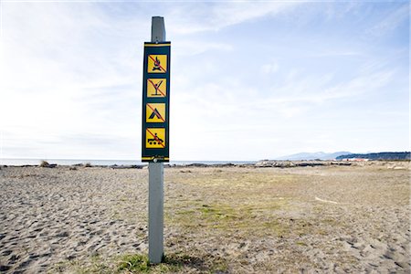 signage on the beach - Signage at Iona Beach, Richmond, British Columbia, Canada Stock Photo - Premium Royalty-Free, Code: 600-02700263