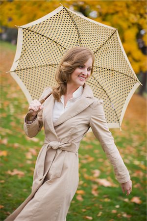 picture of umbrella style - Woman With an Umbrella Walking in the Park, Portland, Oregon, USA Stock Photo - Premium Royalty-Free, Code: 600-02700634