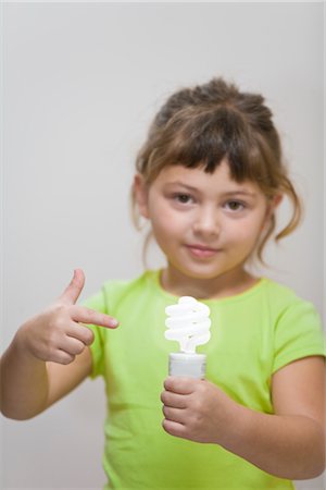 fluorescent light bulb - Little Girl Holding Energy Efficient Lightbulb Stock Photo - Premium Royalty-Free, Code: 600-02700898
