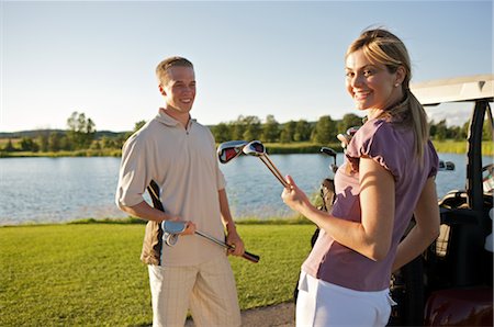 Couple Playing Golf, Burlington, Ontario, Canada Stock Photo - Premium Royalty-Free, Code: 600-02701184