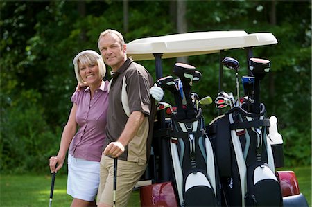 Couple Playing Golf, Burlington, Ontario, Canada Stock Photo - Premium Royalty-Free, Code: 600-02701224