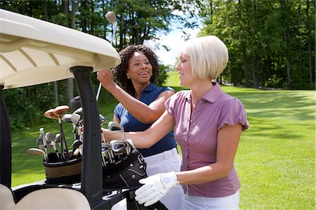 Women Unloading Golf Cart, Burlington, Ontario, Canada Stock Photo - Premium Royalty-Free, Code: 600-02701223