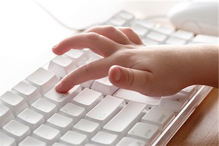 picture of a keyboard computer kids - Child Pressing Delete Key on Computer Stock Photo - Premium Royalty-Free, Code: 600-02701264