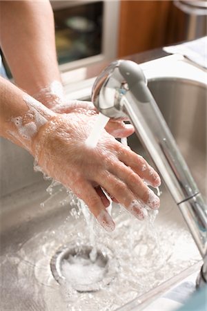 Man Washing his Hands Stock Photo - Premium Royalty-Free, Code: 600-02702515