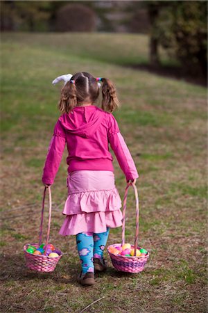 Young Girl Walking with Easter Baskets Fotografie stock - Premium Royalty-Free, Codice: 600-02724719