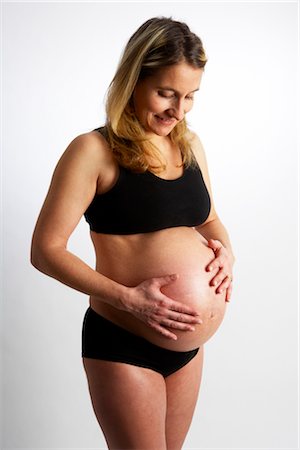 female pregnant belly expansion - Portrait of Pregnant Woman Stock Photo - Premium Royalty-Free, Code: 600-02723144
