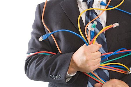 plugged in - Close-up of Businessman Holding CAT5 Cables Stock Photo - Premium Royalty-Free, Code: 600-02757040