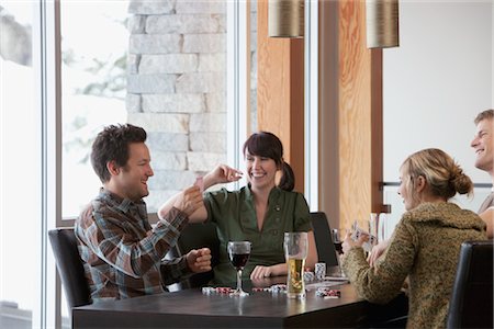 photo of card playing woman - Friends Playing Poker Stock Photo - Premium Royalty-Free, Code: 600-02757354