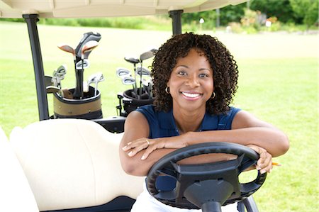 simsearch:600-03848834,k - Portrait de femme assise en voiturette de Golf Photographie de stock - Premium Libres de Droits, Code: 600-02751490
