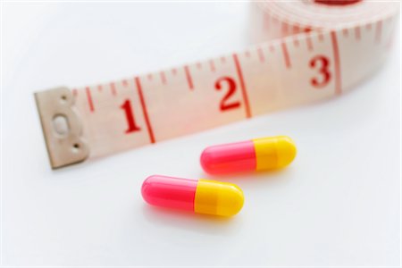 diet pills - Pills and Measuring Tape Stock Photo - Premium Royalty-Free, Code: 600-02786797