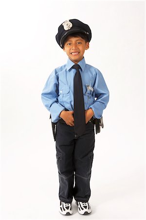 policier (homme) - Garçon habillé comme agent de Police Photographie de stock - Premium Libres de Droits, Code: 600-02786814
