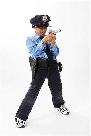 Boy Dressed as Police Officer Foto de stock - Sin royalties Premium, Código: 600-02786815