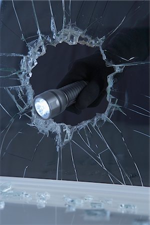 flashlight - Hand Holding Flashlight Through Broken Window Stock Photo - Premium Royalty-Free, Code: 600-02801125