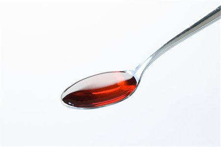 spoon with syrup - Spoonful of Medicine Stock Photo - Premium Royalty-Free, Code: 600-02833485