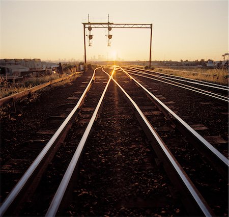 sunset train tracks - Railway Lines at Sunset Stock Photo - Premium Royalty-Free, Code: 600-02885969