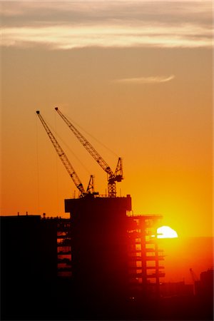 Office Building Construction Cranes, Sunset Silhouette Stock Photo - Premium Royalty-Free, Code: 600-02886043