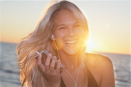 simsearch:600-01614178,k - Woman on the Beach Listening to MP3 Player Stock Photo - Premium Royalty-Free, Code: 600-02887100