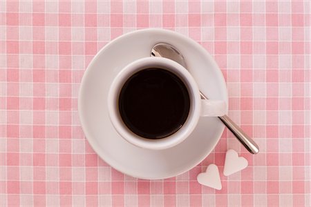 saucer - Coffee Cup with Heart-shaped Sugar Lumps Stock Photo - Premium Royalty-Free, Code: 600-02903817