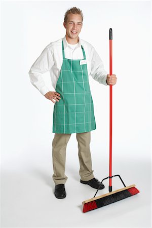 Portrait of Grocery Clerk Holding a Broom Stock Photo - Premium Royalty-Free, Code: 600-02912445