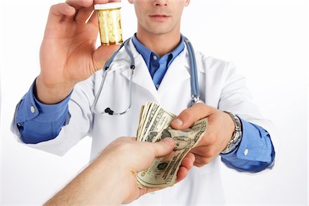 rimedio contro il dolore - Doctor Accepting Money Fotografie stock - Premium Royalty-Free, Codice: 600-02912771