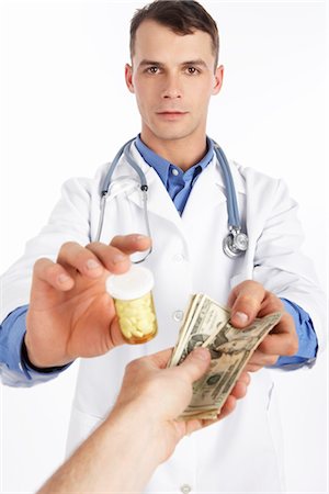 doctor appointment mature - Doctor Exchanging Pills For Money Stock Photo - Premium Royalty-Free, Code: 600-02912794