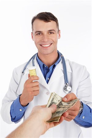 Arzt den Austausch von Pillen für Geld Stockbilder - Premium RF Lizenzfrei, Bildnummer: 600-02912795