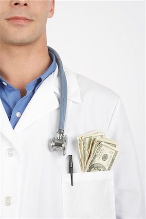 financement - Argent caché dans la poche du médecin Photographie de stock - Premium Libres de Droits, Code: 600-02912798