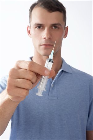 drugs (recreational) - Man Holding Needle Stock Photo - Premium Royalty-Free, Code: 600-02912809