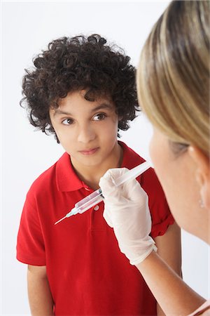 pictures of curly hair hispanics - Boy About to Get a Needle Stock Photo - Premium Royalty-Free, Code: 600-02912816