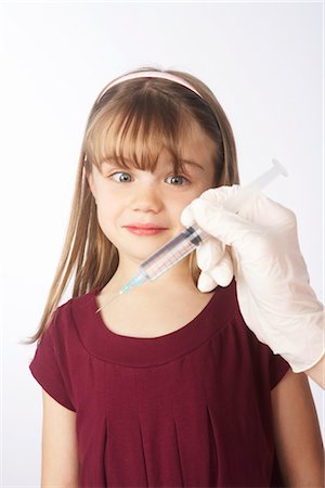 Girl About to Get a Needle Stock Photo - Premium Royalty-Free, Code: 600-02912818