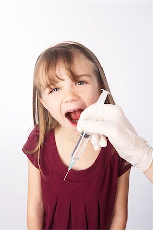 Anxious Girl About to Get a Needle Stock Photo - Premium Royalty-Free, Code: 600-02912819