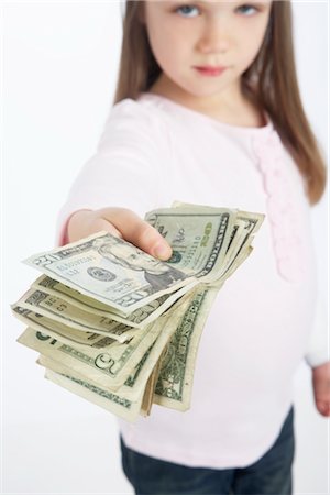 simsearch:600-02912820,k - Girl Holding Cash Stock Photo - Premium Royalty-Free, Code: 600-02912838