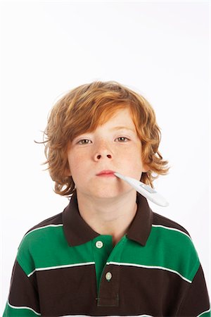 Boy With a Thermometer in His Mouth Foto de stock - Royalty Free Premium, Número: 600-02912840