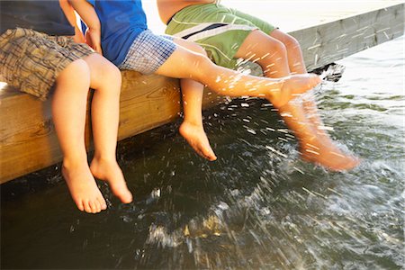 family holiday cottage - Children's Legs, Lake Simcoe, Ontario, Canada Stock Photo - Premium Royalty-Free, Code: 600-02913202